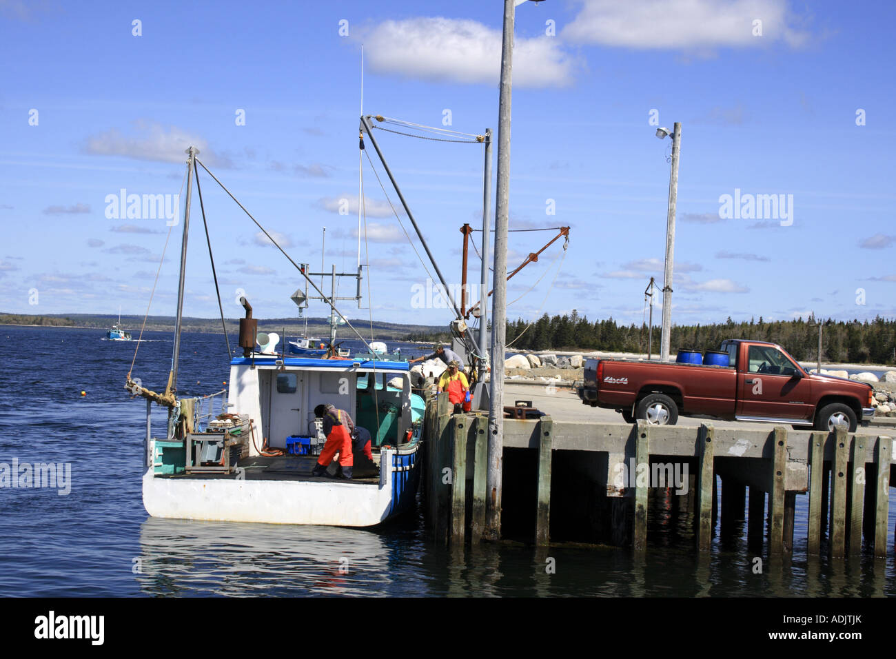 unloading fishing boat East Side Port l`Herbert, Lighthouse Route, Nova Scotia, Canada, North America. Photo by Willy Matheisl Stock Photo